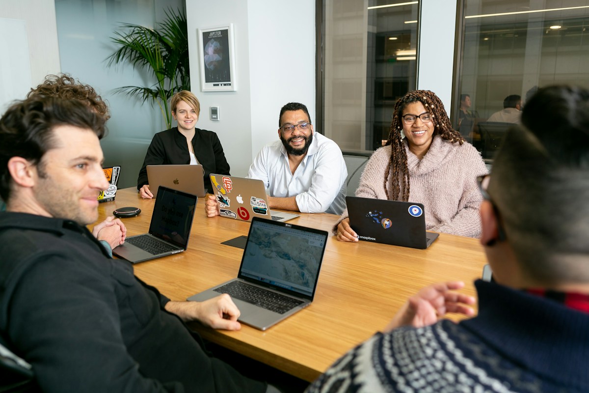 Professional team reviewing documentation together